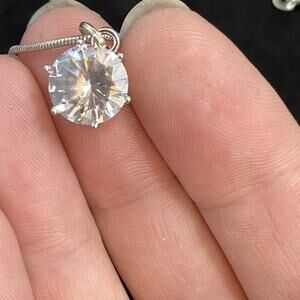 Minicci silver colored round rhinestone pendant necklace. adjustable. sparkly